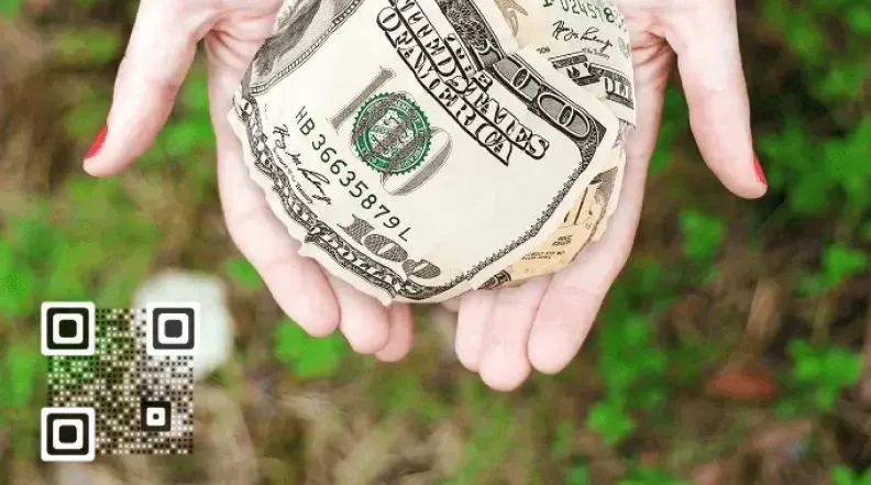 Hands holding money with a QR code, showing how the QR code facilitates fundraising efforts.